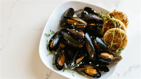  Moules Frites! Tantalize Your Taste Buds with the Exquisite Simplicity of Mussels and Fries.